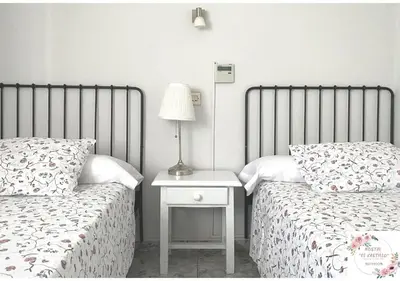Cama o camas de una habitación en Hostal El Castillo