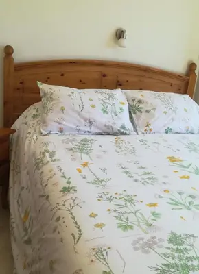 Cama o camas de una habitación en Hostal El Castillo