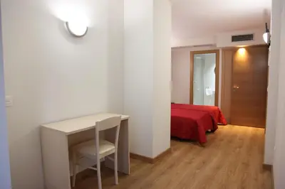 Cama o camas de una habitación en Hostal Santel San Marcos
