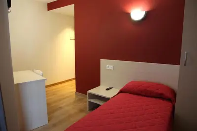 Cama o camas de una habitación en Hostal Santel San Marcos