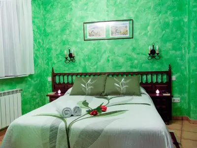 Cama o camas de una habitación en Casas Rurales Florentino