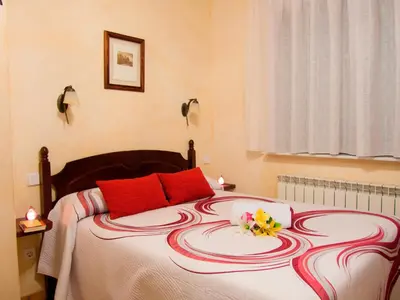 Cama o camas de una habitación en Casas Rurales Florentino