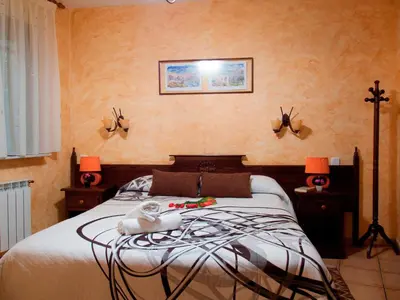 Cama o camas de una habitación en Casas Rurales Florentino