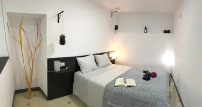 Cama o camas de una habitación en Loft Arco del Cristo.