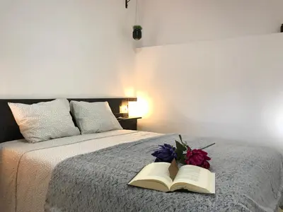 Cama o camas de una habitación en Loft Arco del Cristo.