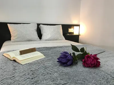 Cama o camas de una habitación en Loft Arco del Cristo.