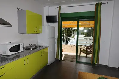 Una cocina o zona de cocina en Apartamentos Villa Vacacional