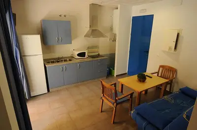 Una cocina o zona de cocina en Apartamentos Villa Vacacional