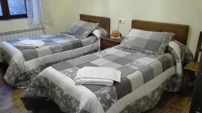 Cama o camas de una habitación en Entre las Piedras y musgo