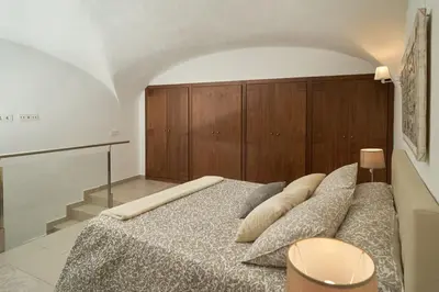 Cama o camas de una habitación en Apartamento Turístico Centro Monumental -- Caceres