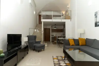 Zona de estar de Apartamento Turístico Centro Monumental -- Caceres