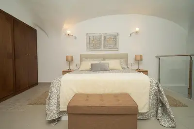 Cama o camas de una habitación en Apartamento Turístico Centro Monumental -- Caceres