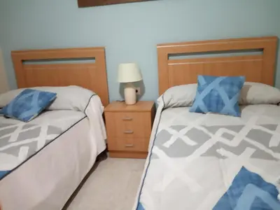 Cama o camas de una habitación en Apartamento Turistico La Victoria