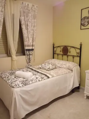 Cama o camas de una habitación en Apartamento Turistico La Victoria