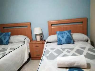 Cama o camas de una habitación en Apartamento Turistico La Victoria