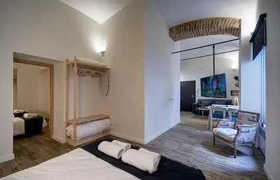 Cama o camas de una habitación en Apartamentos AL-QAZERES LUXURY La Concepción