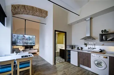 Una cocina o zona de cocina en Apartamentos AL-QAZERES LUXURY La Concepción