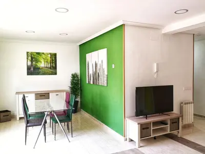 Una televisión o centro de entretenimiento en Apartamentos Cocó