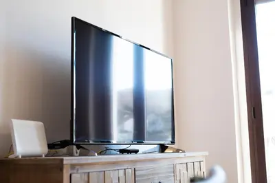 Una televisión o centro de entretenimiento en Apartamento Plaza Mayor Cáceres