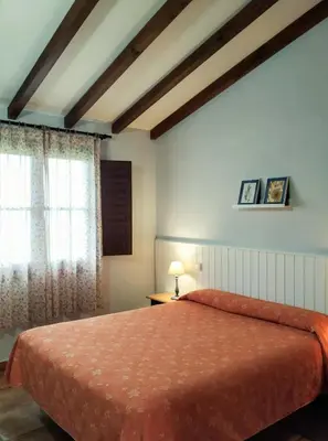 Cama o camas de una habitación en Apartamentos El Calambuco