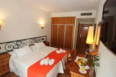 Cama o camas de una habitación en Hotel La Bodega