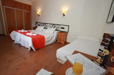 Cama o camas de una habitación en Hotel La Bodega