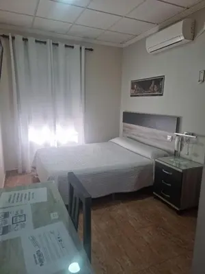 Cama o camas de una habitación en Hostal Restaurante el Paraíso
