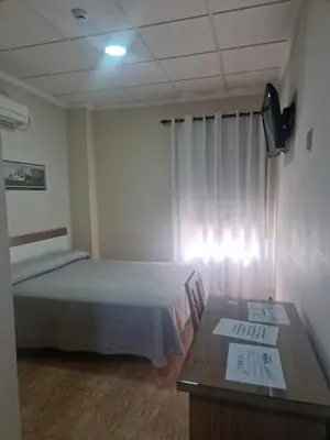 Cama o camas de una habitación en Hostal Restaurante el Paraíso