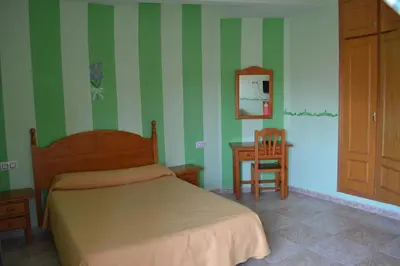 Cama o camas de una habitación en Hostal Vadillo