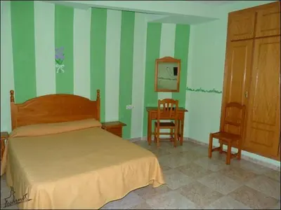 Cama o camas de una habitación en Hostal Vadillo