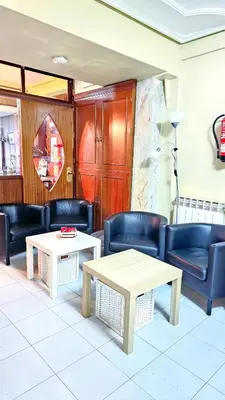Zona de estar de Hostal La Rosa