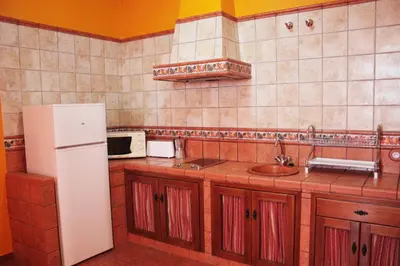 Una cocina o zona de cocina en Apartamentos Trinidad