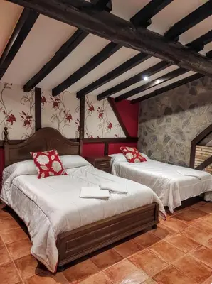 Cama o camas de una habitación en Apartamentos Rurales Fuente Chiquita