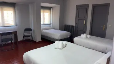 Cama o camas de una habitación en Hostal La Estación