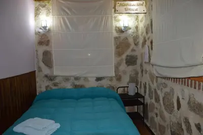 Cama o camas de una habitación en Chalet Rural en Navaluenga