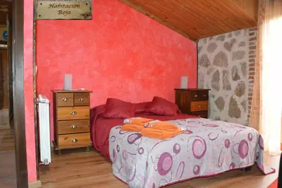 Cama o camas de una habitación en Chalet Rural en Navaluenga
