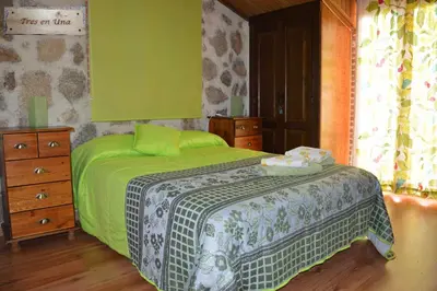 Cama o camas de una habitación en Chalet Rural en Navaluenga