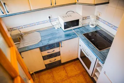 Una cocina o zona de cocina en Apartamentos el Cardenillo