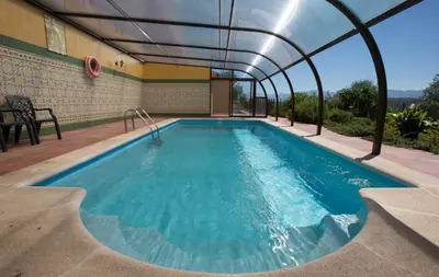 Piscina en o cerca de Apartamentos El Jardín del Poeta