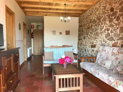 Zona de estar de Apartamentos El Jardín del Poeta