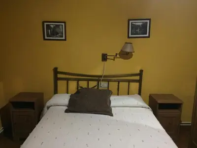 Cama o camas de una habitación en LA ANTIGUA TAHONA
