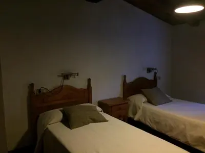 Cama o camas de una habitación en LA ANTIGUA TAHONA