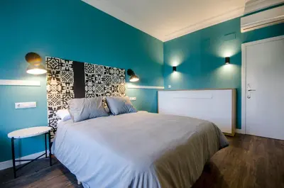 Cama o camas de una habitación en Apartamentos Suites Roma