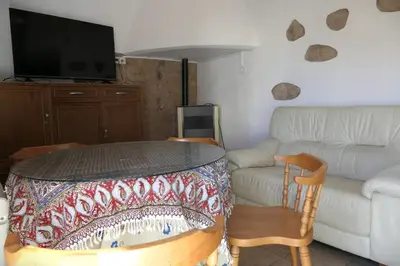 Una televisión o centro de entretenimiento en Apartamentos Altozano