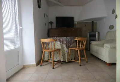 Una televisión o centro de entretenimiento en Apartamentos Altozano