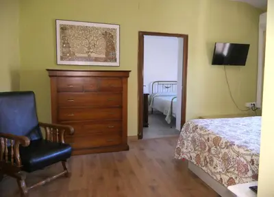 Cama o camas de una habitación en Apartamentos Altozano