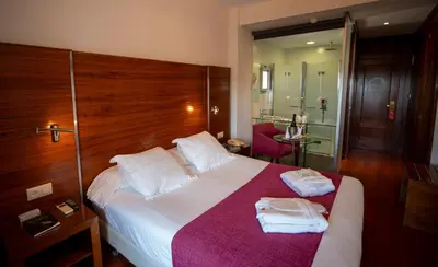 Cama o camas de una habitación en Hotel Rural Spa Don Juan de Austria