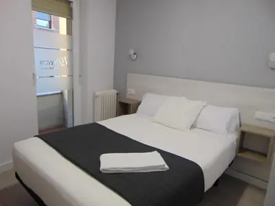 Cama o camas de una habitación en Hostal I Dream Salamanca