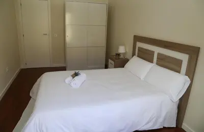 Cama o camas de una habitación en Apartamentos Turísticos Puente Romano P2 2-A