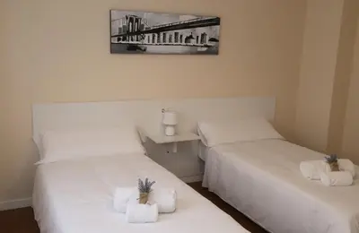 Cama o camas de una habitación en Apartamento Turistico Puente Romano P4 bajo C